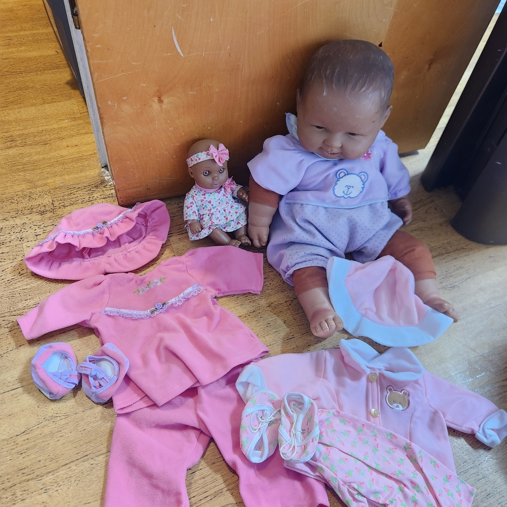 Adorable Baby Doll with Pink and Purple Outfits
